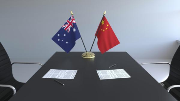 800x450%20Flags%20of%20Australia%20and%20China%20and%20papers%20on%20the%20table