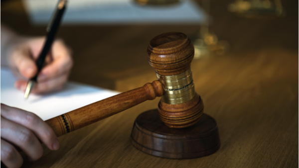 800x450%20gavel%20with%20scales%20on%20wooden%20table