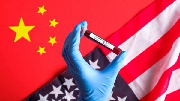 800x450%20Nurse%20hand%20holding%20test%20tube%20with%20infected%20blood%20over%20Chinese%20flag%20and%20flag%20of%20the%20United%20States%20of%20America
