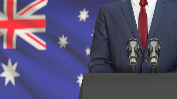 800x450%20politician%20making%20speech%20from%20behind%20the%20pulpit%20with%20national%20flag%20on%20background%20-%20Australia