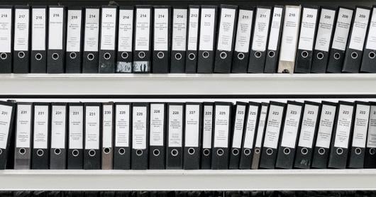 Bookshelf full of ring binders