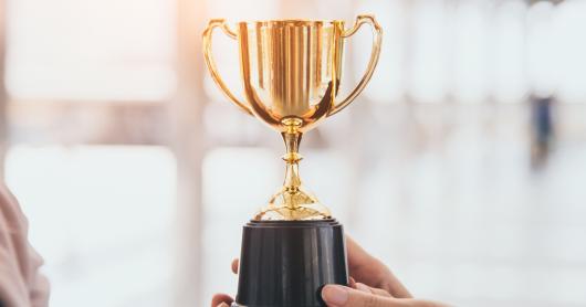 Champion golden trophy for winner background. Success and achievement concept.