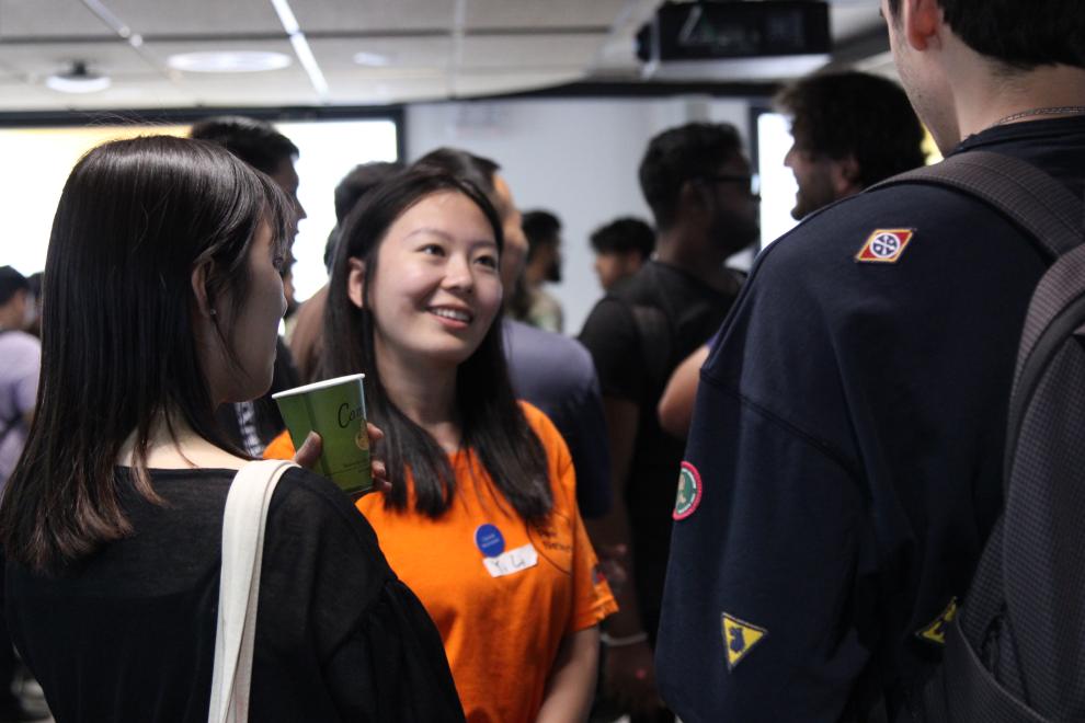 A Peer Networker smiling during conversation with students.