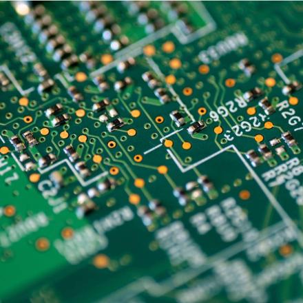 Close range view of a green and white circuit board