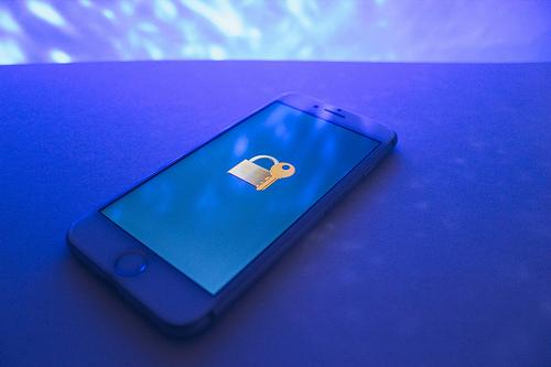 An iPhone showing a lock and key icon
