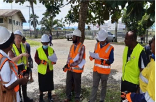 Workers in high vision jackets