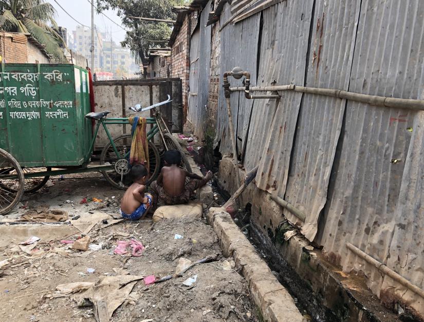 Two children playing in a polluted area