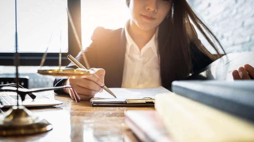 woman studies at desk