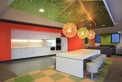 Yura Mudang's colourful kitchen and lounge area with striking round lights