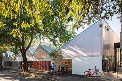 Blackfriars Children's Centre entry with families and a bicycle