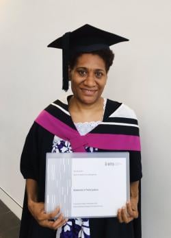 Harriet Rini with her Masters Certificate