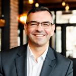 Portrait of Darren Manolis Cox - Director for the ANZ region at IBISWorld