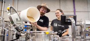  Young Henrys Head Brewer Jesse Searls works with PhD student Laryssa Raffa in the UTS Industry 4.0 Brewery