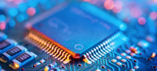 close up shot of a semiconductor on a circuit board