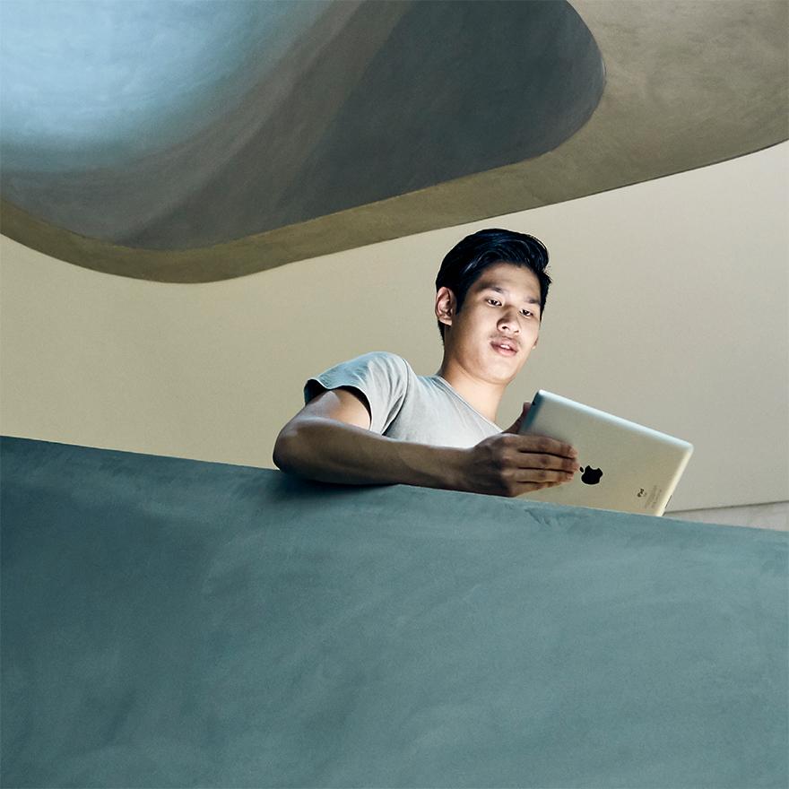 UTS male student using tablet in futuristic backdrop