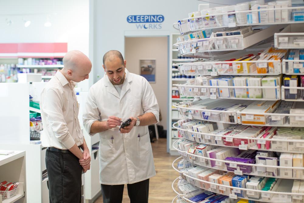 pharmacist helps customer