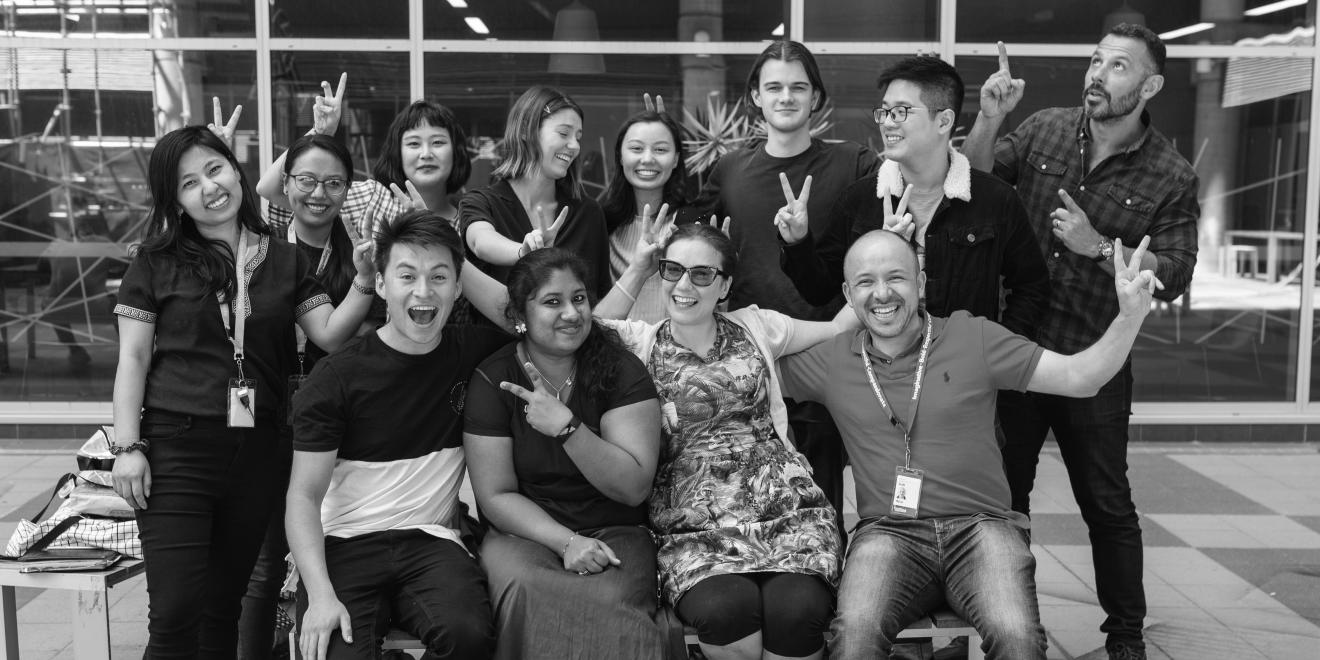 UTS design students smiling with community organisation they worked on a project with.