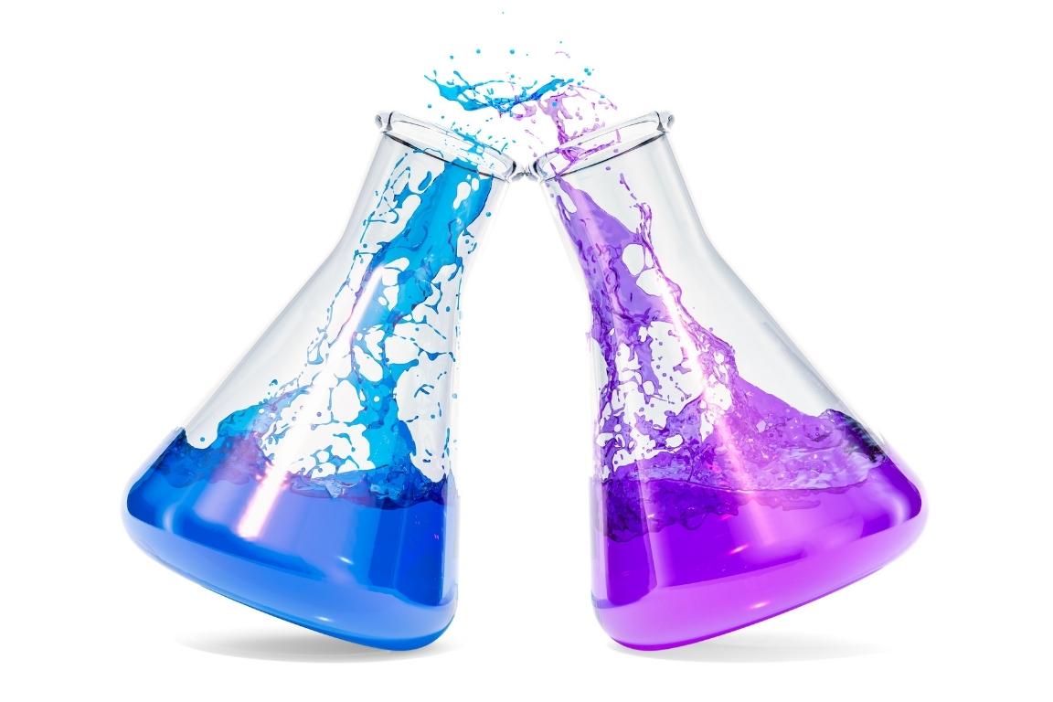 Two chemistry jars, one with blue liquid, one with purple