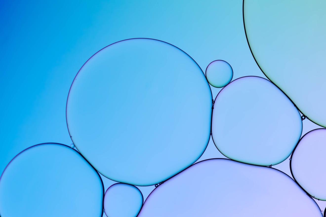 large bubbles on a blue and purple background