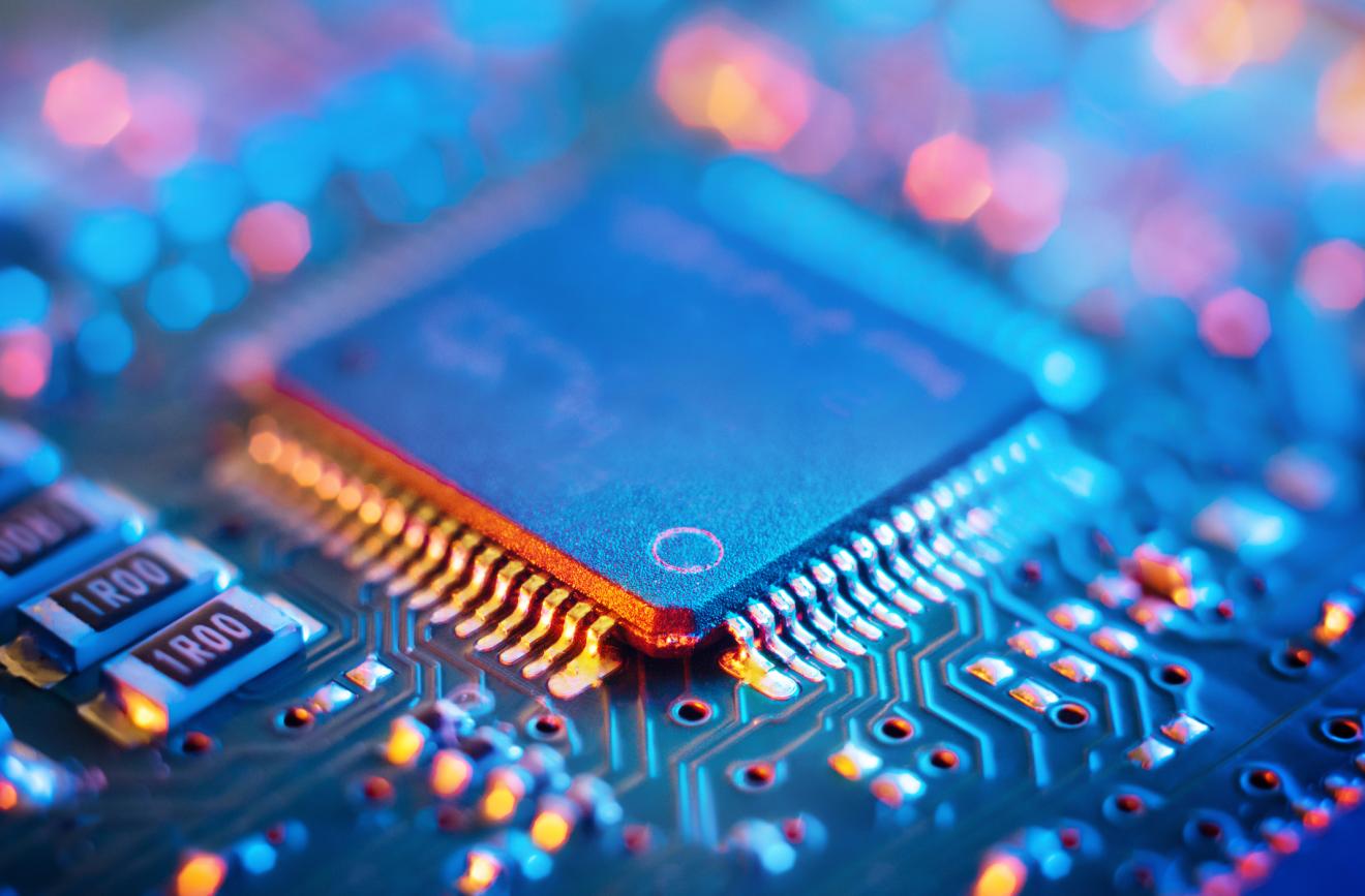 close up shot of a semiconductor on a circuit board