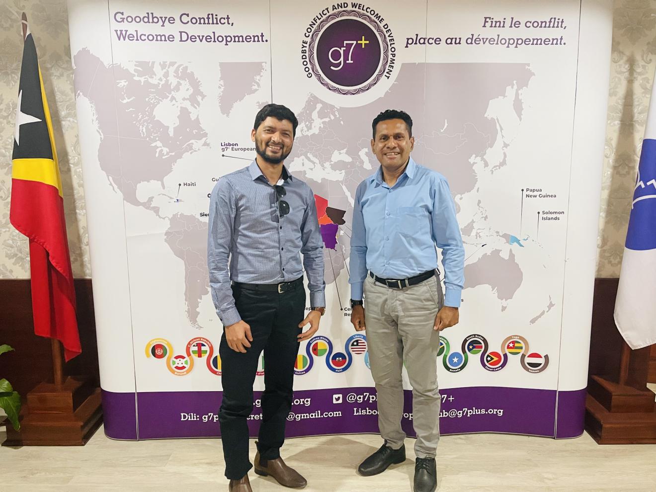 Image of Prakash Paudel with a colleague at  a g7+ conference.