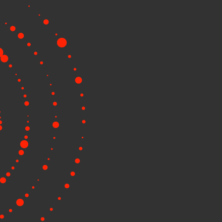 Circular red dots on a dark gray background.