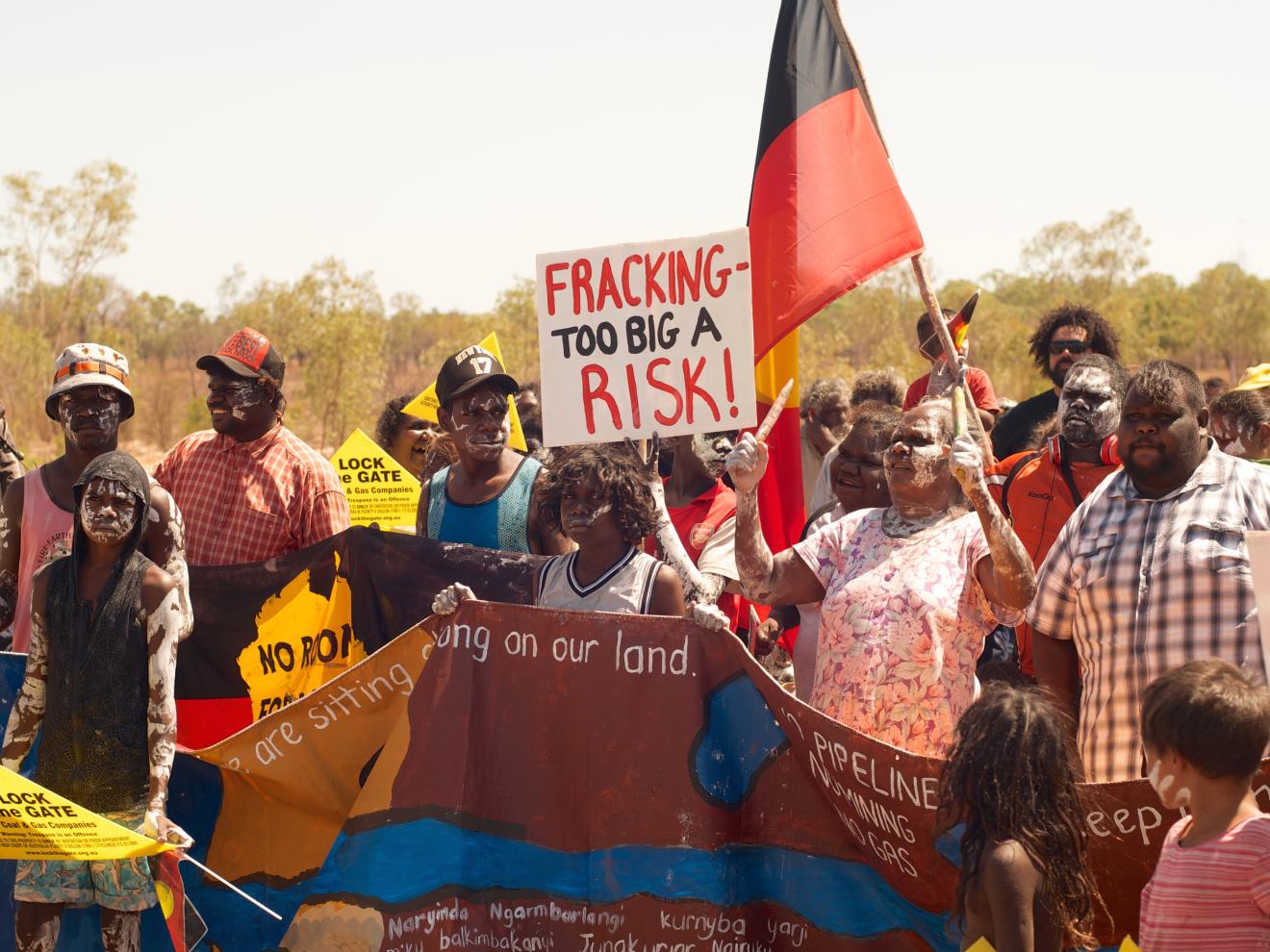 A group of Indigenous people asserting sovereignty over their lands and contesting unwanted and destructive development