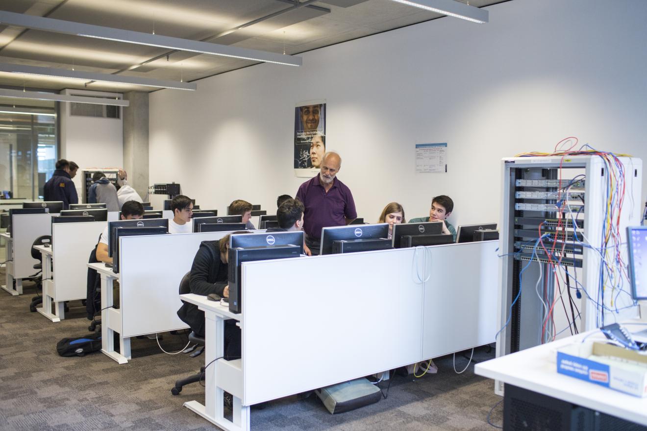 Information Technology students working in a classroom in the new building