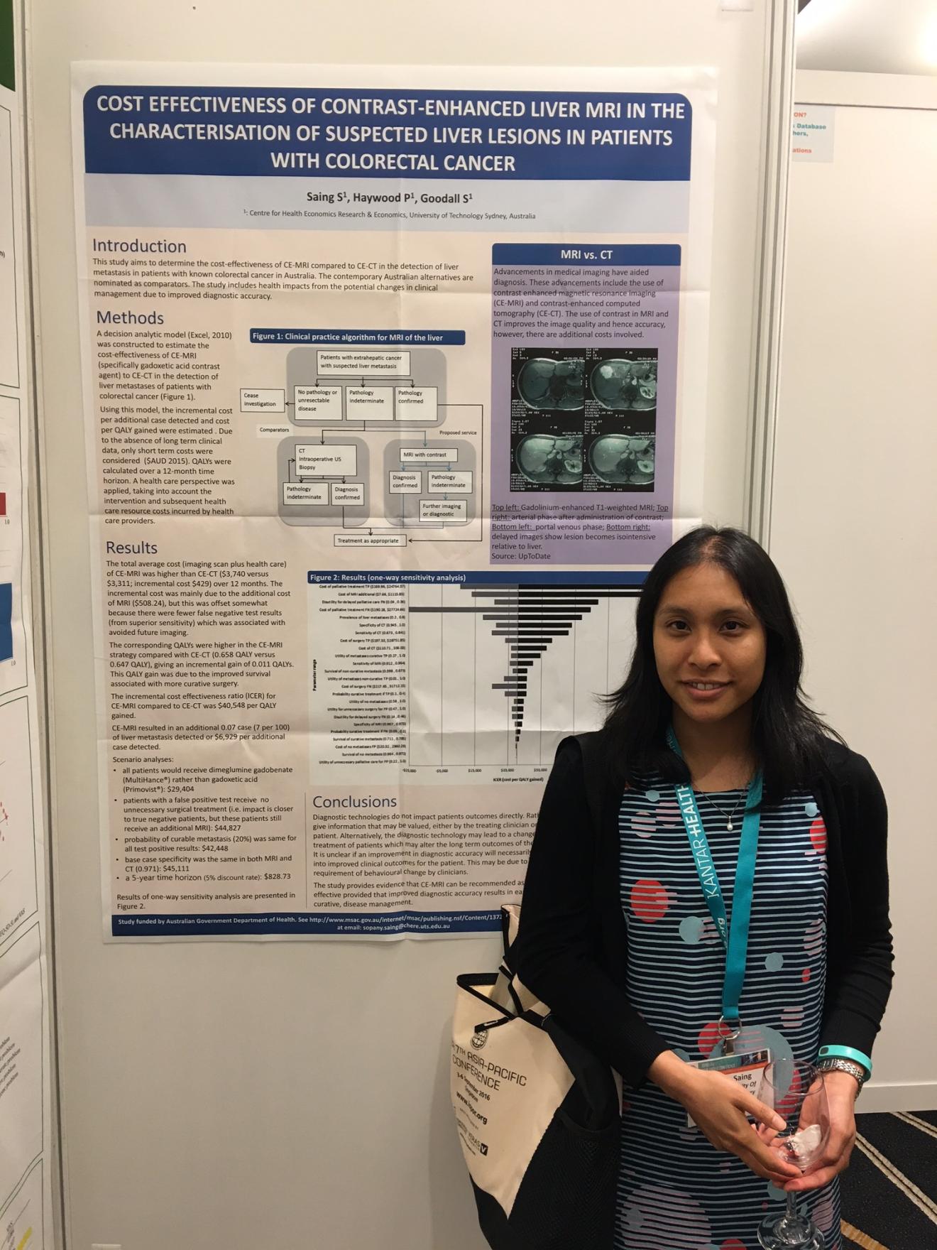 Sopany Saing is standing in front of her poster at the Conference