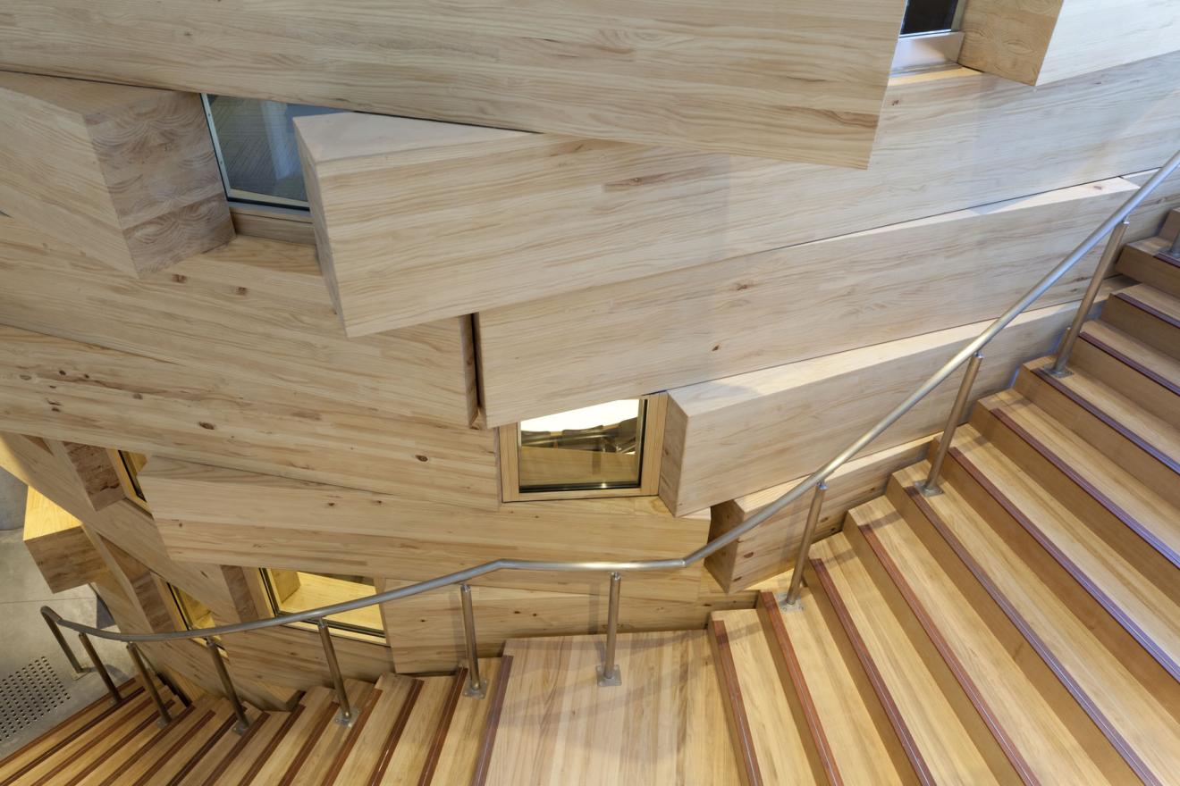 Stair K wraps around the oval classroom on level 3 to the student lounge above on level 4. It is made of Victorian ash. 