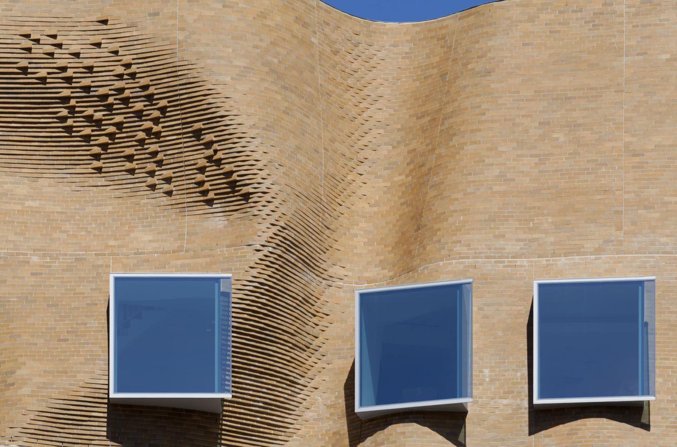 Detail photo of the undulating brick of the Dr Chau Chak Wing Building