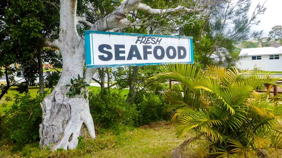 Photo of a local sign for "Fresh Seafood"
