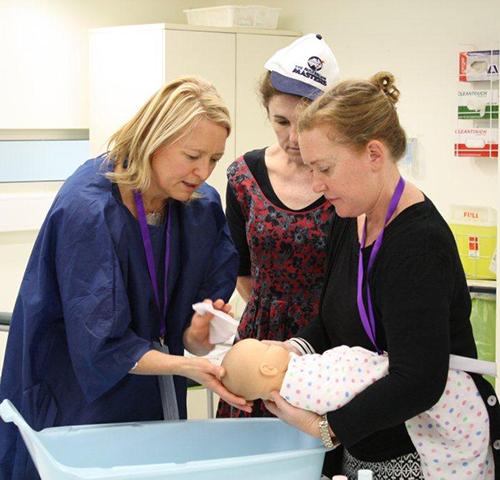 Students participating in midwifery simulation exercise