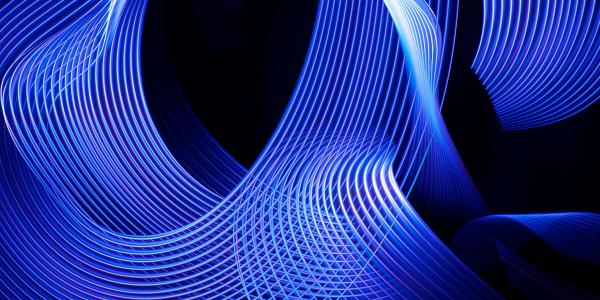Blue light patterns on a dark background - UTS Engineering and IT Solutions