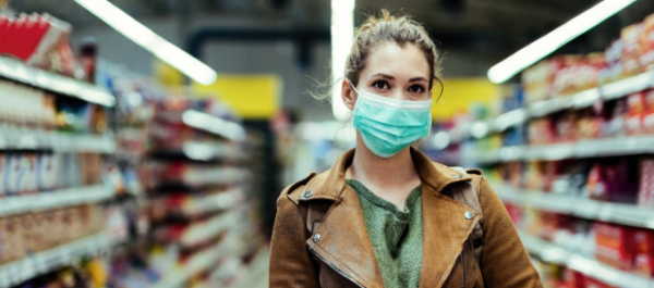 Young women wearing mask in supermarket