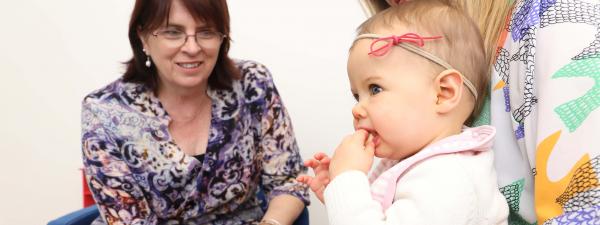 speech pathologist treats baby