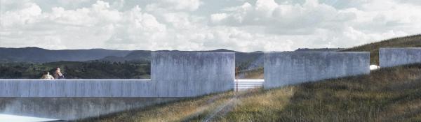Low lying concrete structure in grassy landscape