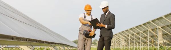 Two men working on solar site