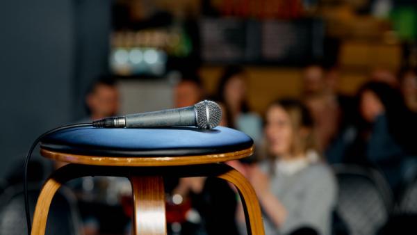 microphone lies on a chair on the stage before the performance