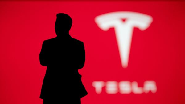 Elon Musk businessman silhouette on Tesla presentation