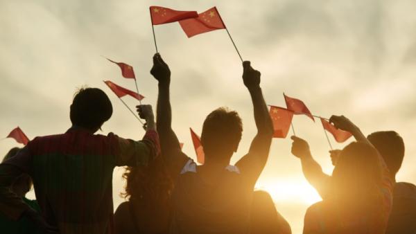 Group of people waving chinese flags