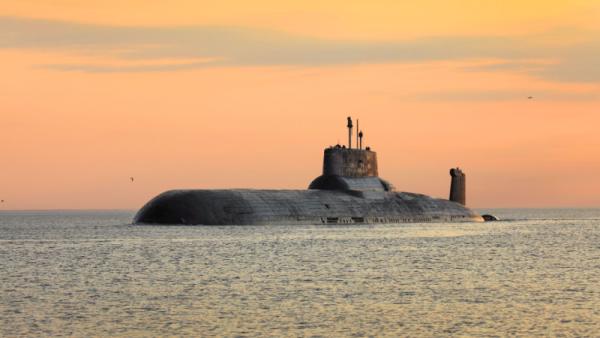 Nuclear submarine at sea at sunset