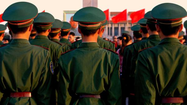 Rows of Chinese soldiers stand at attention
