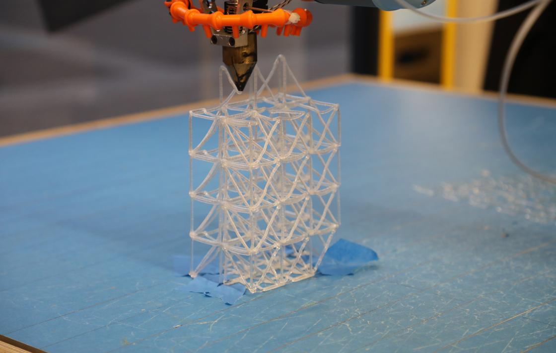 A 3D printing machine producing a plastic prototype