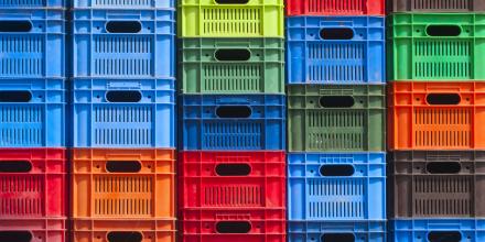 Colourful plastic crates stacked on top of each other