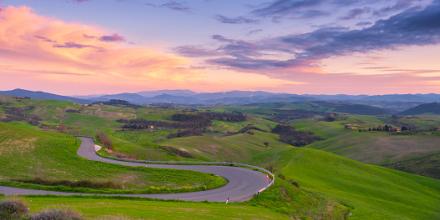A winding road and pink sunset