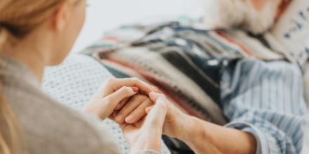 Photo of patient in bed receiving care