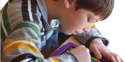 Photo of a child using a tablet device