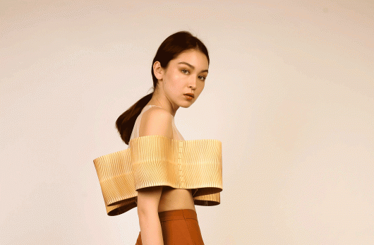 model wears a laser cut design by Jessica Xie