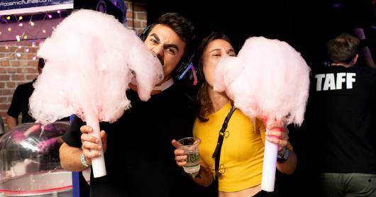 two people eating fairy floss